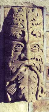 Carved face ornament
