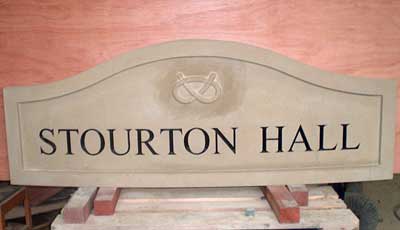 Carved yorkstone house sign