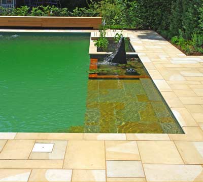 Natural stone swimming pool paving